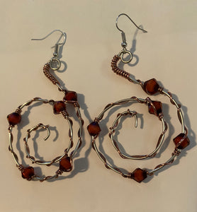 Silver swirl with rust beads